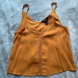 forever 21 mustard yellow tank top with cute design.